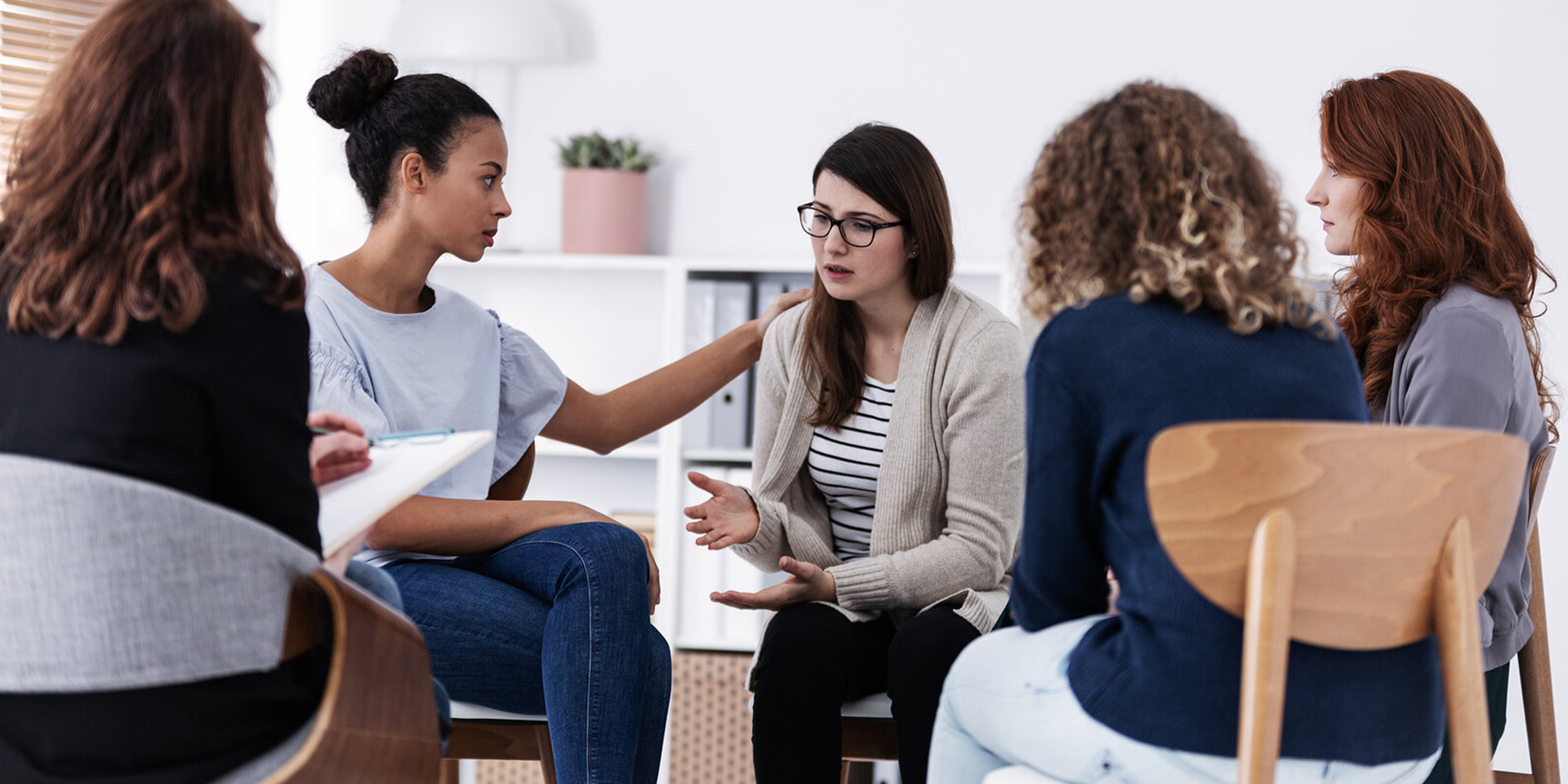 therapist comforting a woman